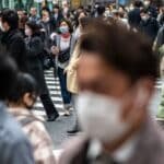 © ADB/Richard Atrero de Guzman People wear protective masks in Tokyo, Japan.